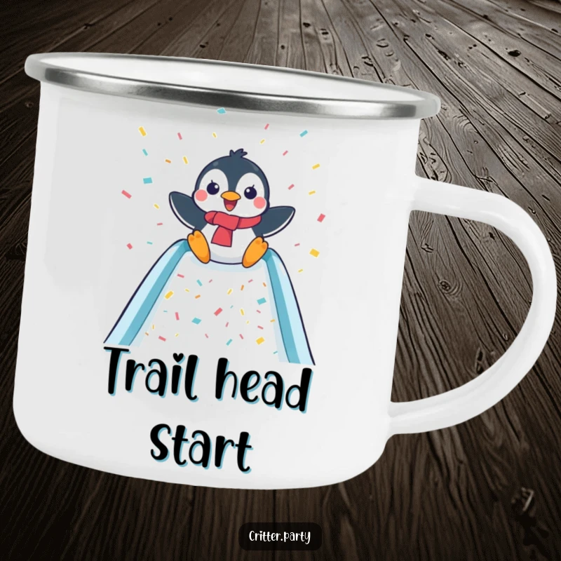 Funny enamel camping mug with a delighted penguin sliding down a confetti-covered slide, perfect for outdoor celebrations.