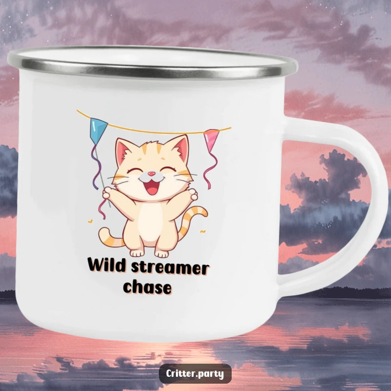 Funny cat camping mug with a playful cat batting at a dangling party streamer, great for outdoor coffee breaks and adding humor.