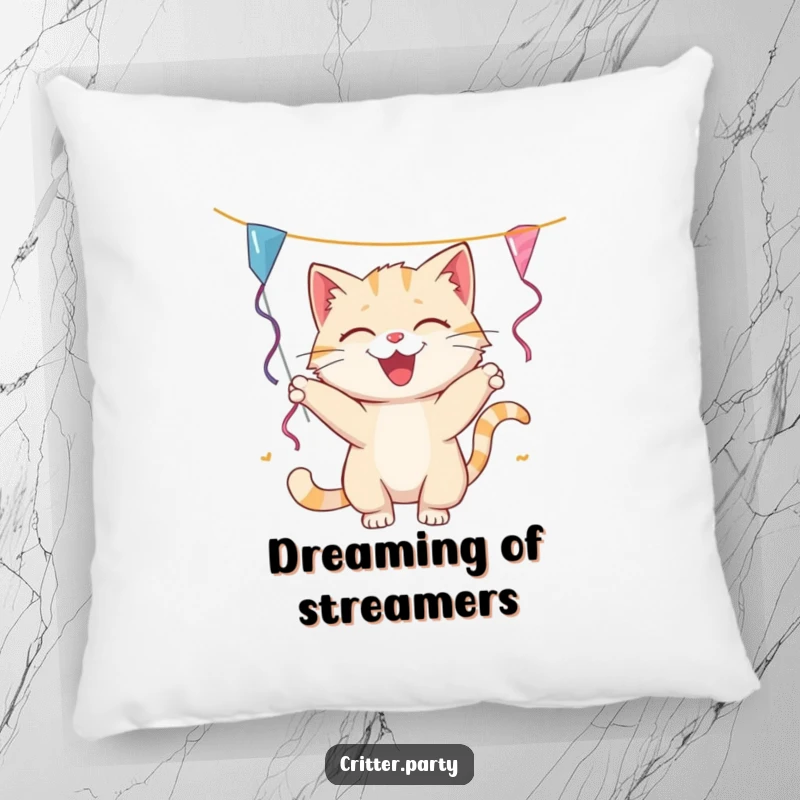 Funny cat pillow featuring a smiling cat playfully batting at a dangling party streamer, ideal for adding comfort and humor to any space.