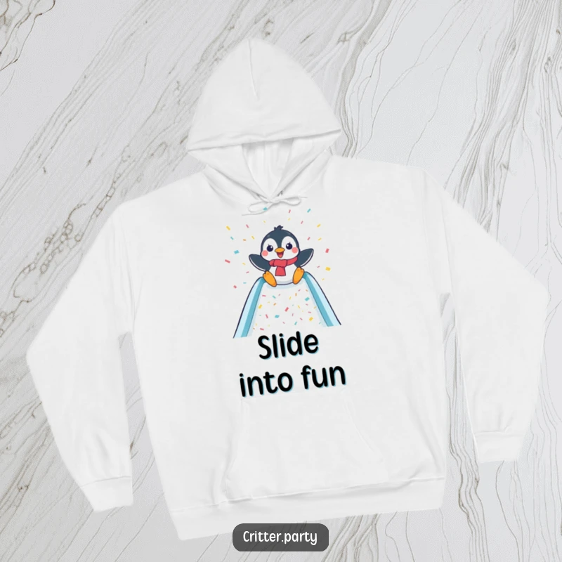 Funny and warm hoodie featuring a delighted penguin joyfully sliding down a confetti-filled slide, perfect for cozy fun.