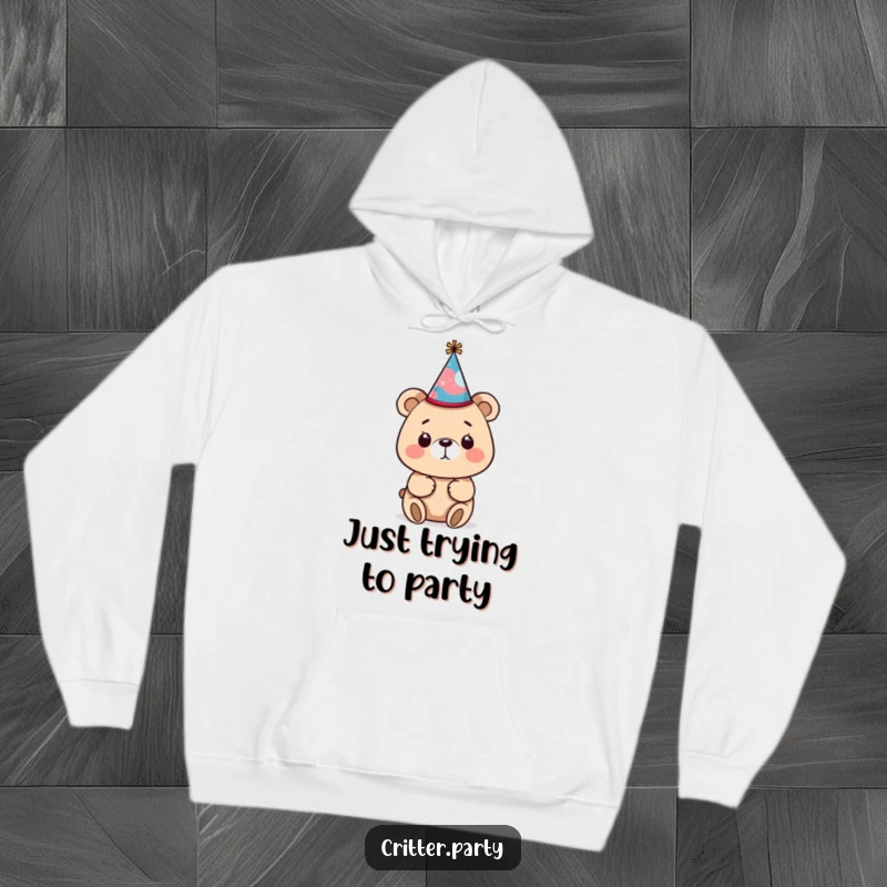 Funny bear wearing a tiny, crooked party hat on a soft hoodie, radiating a cozy and humorous vibe perfect for chilly days.