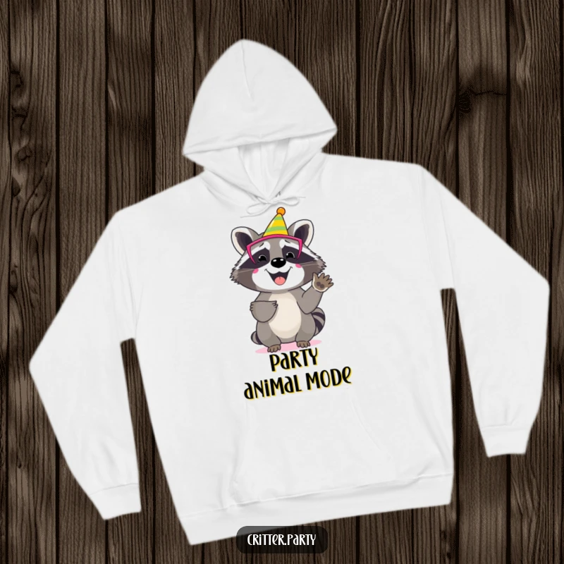 Funny raccoon hoodie featuring a happy character wearing a vibrant party mask, enthusiastically clapping its little paws.