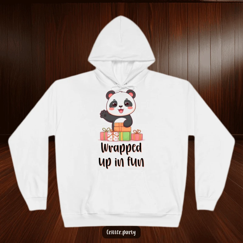 Funny hoodie depicting a joyful panda peeking from behind a stack of vibrant presents, waving with an contagiously happy expression.