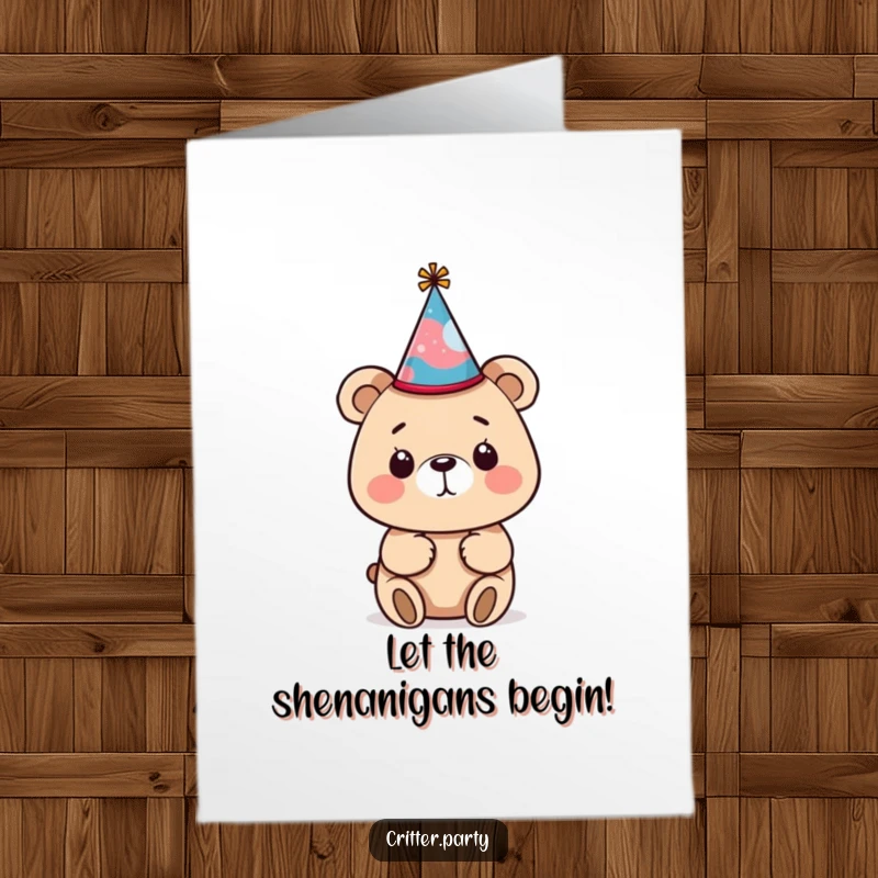 Funny Free Printable Bear Birthday Card: A curious bear struggles comically with a tiny, crooked party hat, ready for laughs.