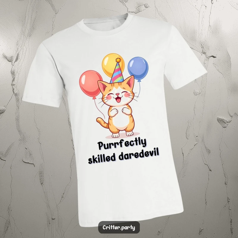 Funny cat in a party hat, enthusiastically juggling three bright balloons, printed on a comfortable t-shirt for ultimate fun.