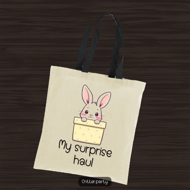 Funny tote bag with a curious rabbit peeking out from a brightly wrapped gift box, perfect for carrying essentials with playful charm.